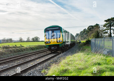 Commuter rail service traveling via Maynooth to Dublin`s Pears Station. Travelling by train in Ireland Stock Photo